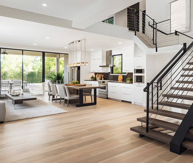 Open living area with a staircase and wood flooring