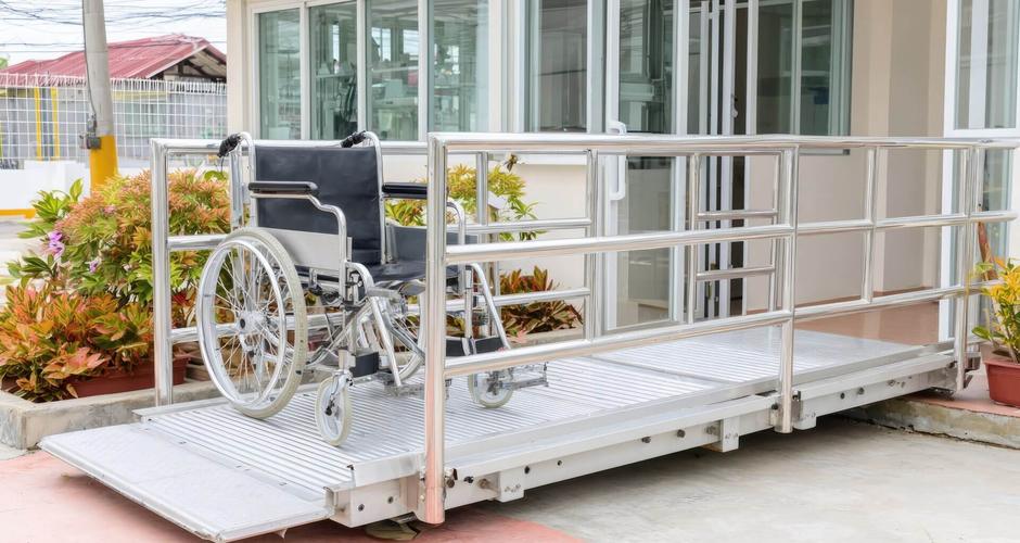Wheelchair on an accessible ramp at a building entrance